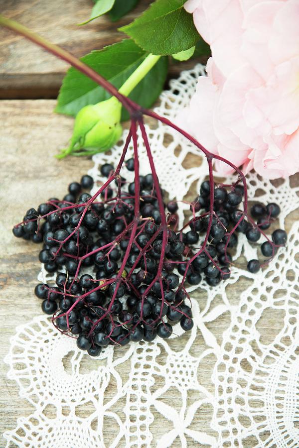 Elderberries On A Crocheted Doily Photograph by Food Experts Group