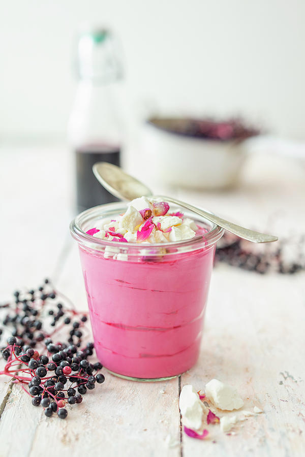 Elderberry Mousse With Dried Rose Petals And Meringue In A Glass Photograph by Jan Wischnewski