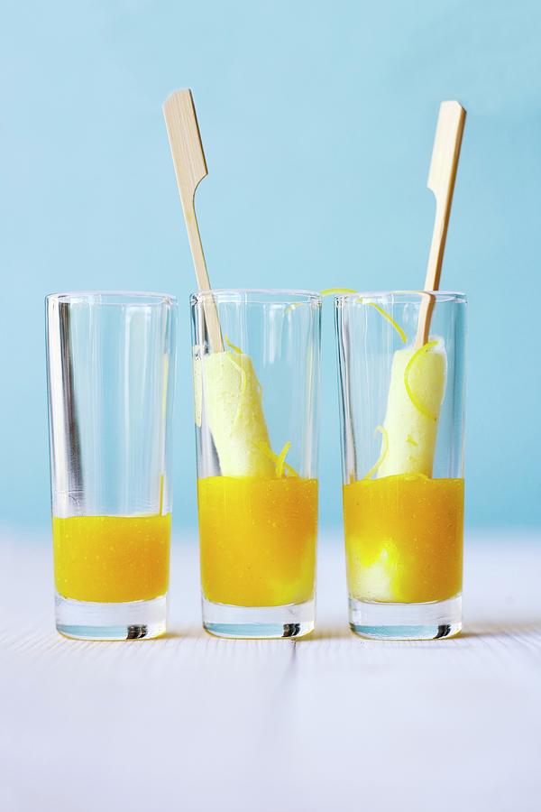 Elderflower And Lemon Sorbet On Sticks With Mango And Elderflower And Jus In Glasses Photograph by Michael Wissing