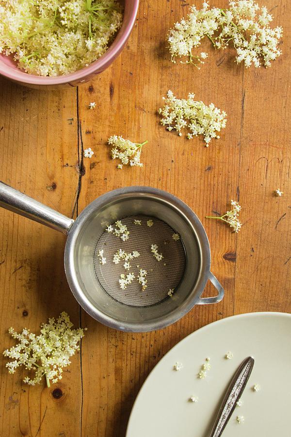 Elderflowers And A Sieve Photograph by Alice Del Re