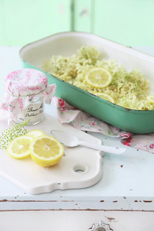 Elderflowers And Lemons In Green Oven Dish On White, Vintage Cabinet Photograph by Syl Loves