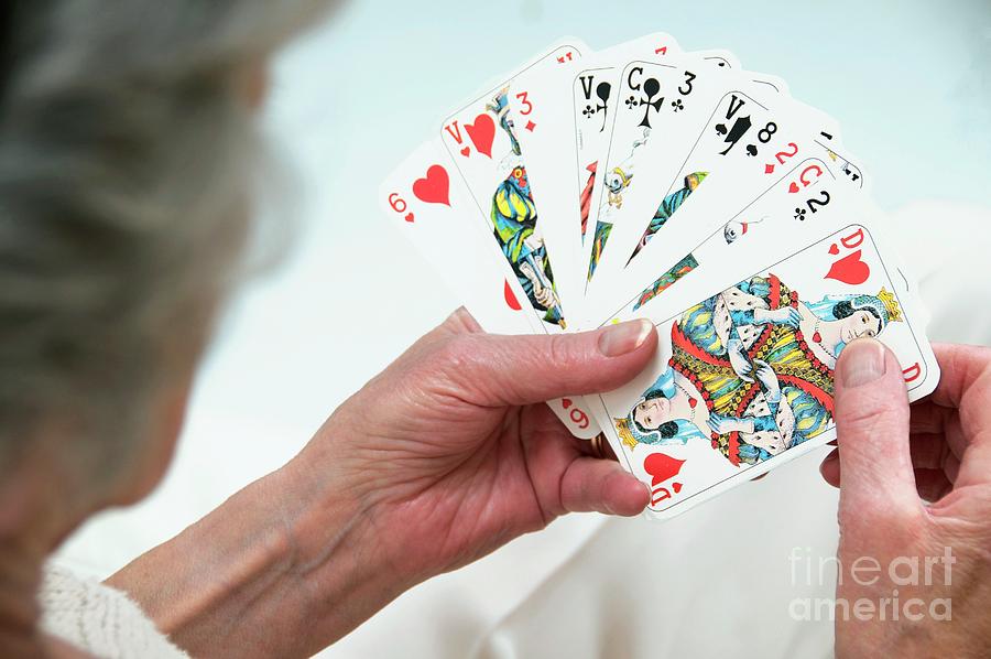 Elderly Woman Playing Cards Photograph by Lea Paterson/science Photo Library