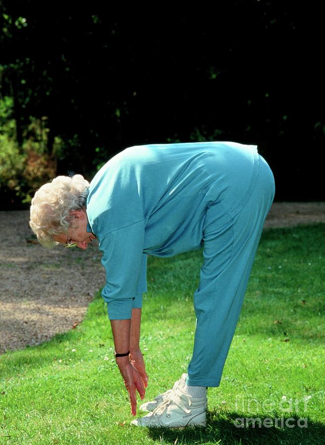 Elderly Woman Touching Her Toes Photograph by Sheila Terry/science ...