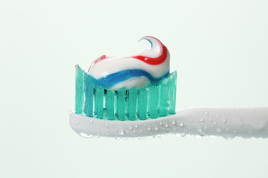Electric Toothbrush With Toothpaste Photograph by Westend61