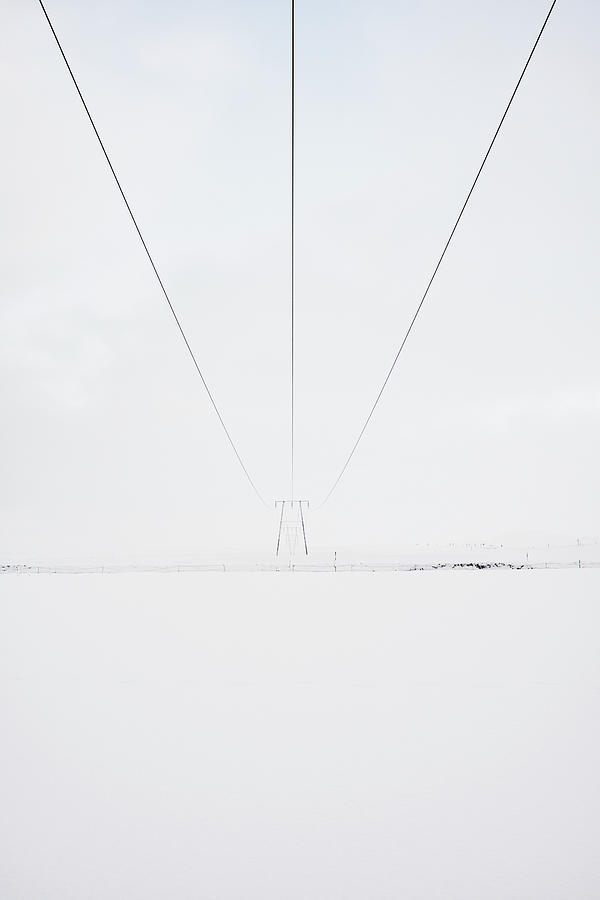 Nature Photograph - Electric Tower On Snowy Land In Countryside by Cavan Images