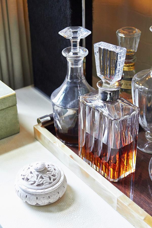 Elegant Crystal Carafes On Tray Next To Hand-carved Stone Box Photograph by Misha Vetter