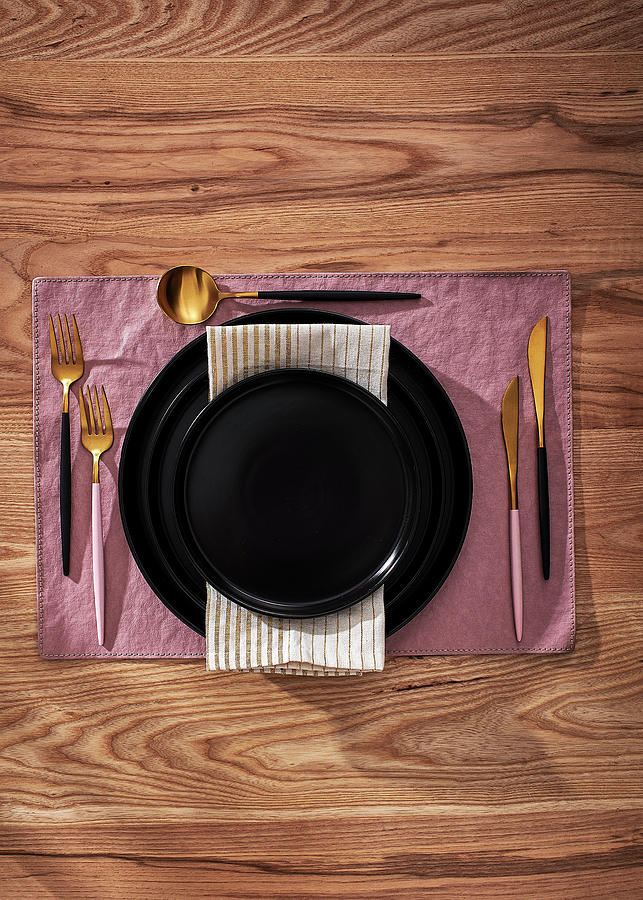 Elegant Place Setting With Black Plates And Gold Cutlery Photograph by Great Stock!