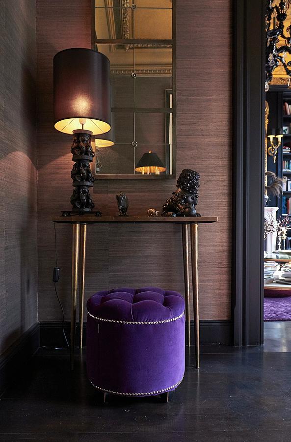 Elegant Purple Pouffe In Front Of Artistic Table Lamp And Animal Ornament On Console Table Photograph by Misha Vetter