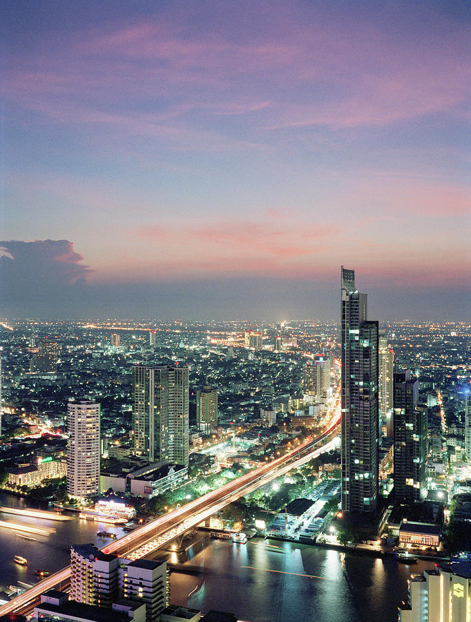 Elevated View Of Bangkok Skyline At Dusk Photograph by Gary Yeowell