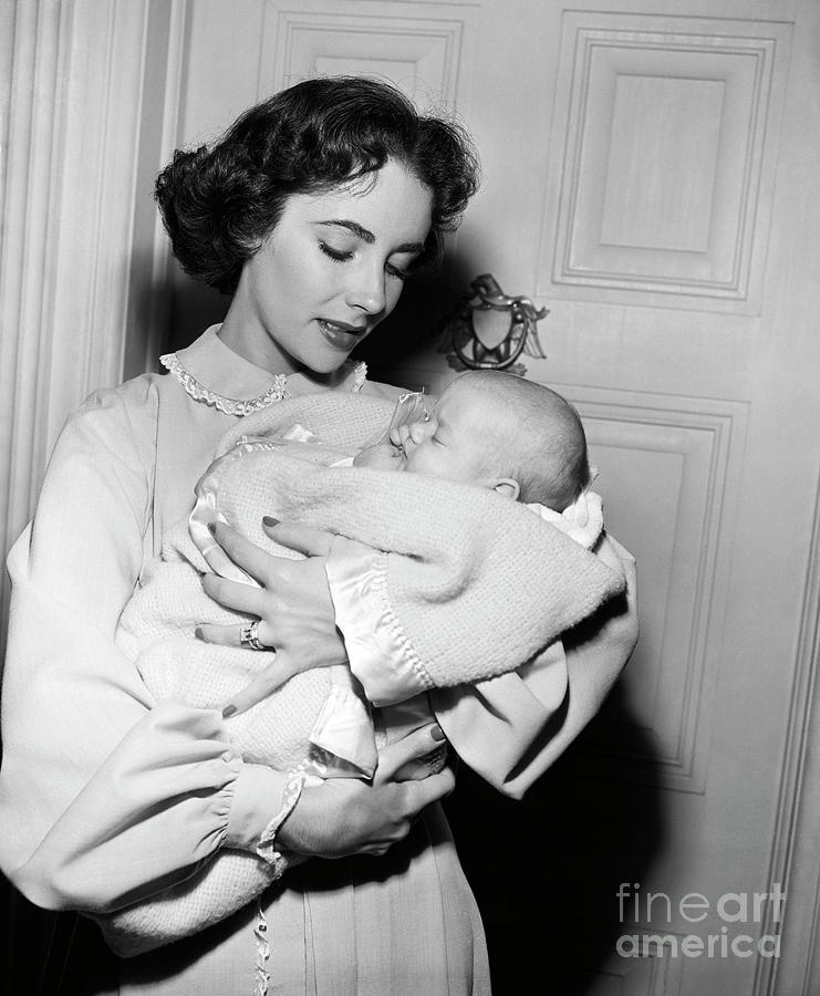 Elizabeth Taylor Holds Baby For Movie Photograph by Bettmann