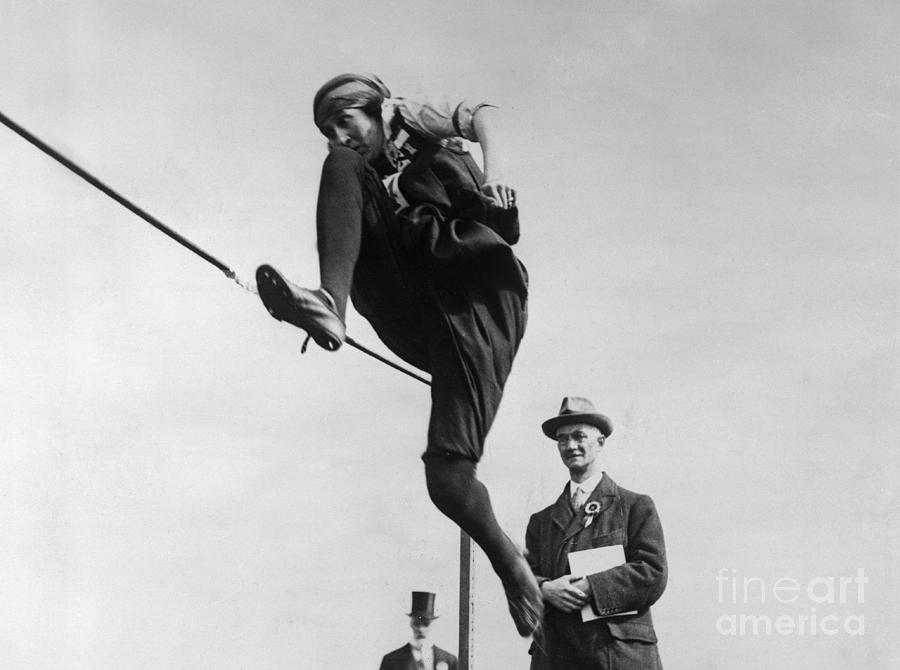 Elliot-lynn In High Jump Action Photograph by Bettmann