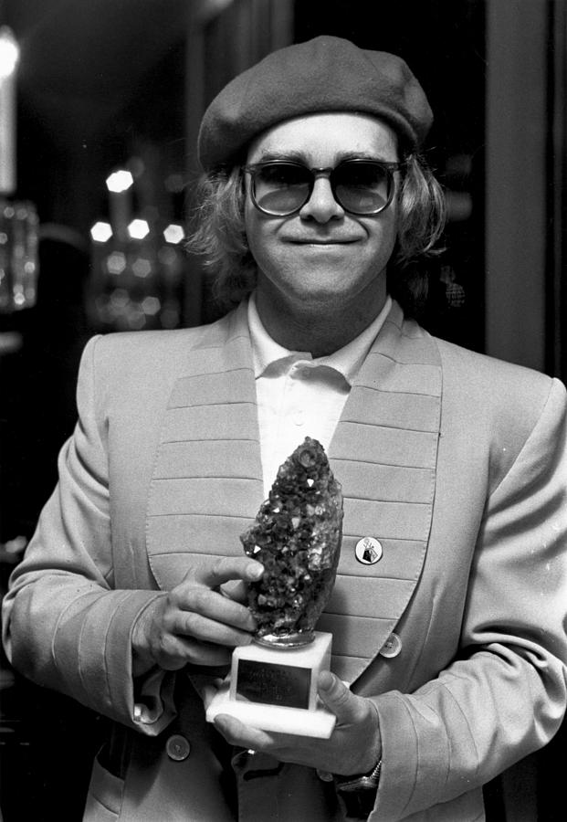 Elton Collects Photograph by Evening Standard