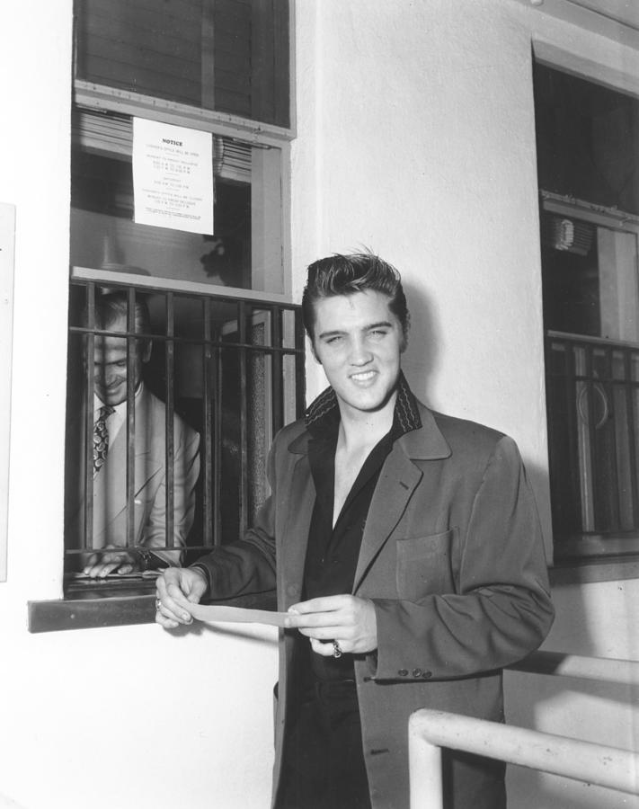 Elvis Presley At A Cashiers Window Photograph by Michael Ochs Archives