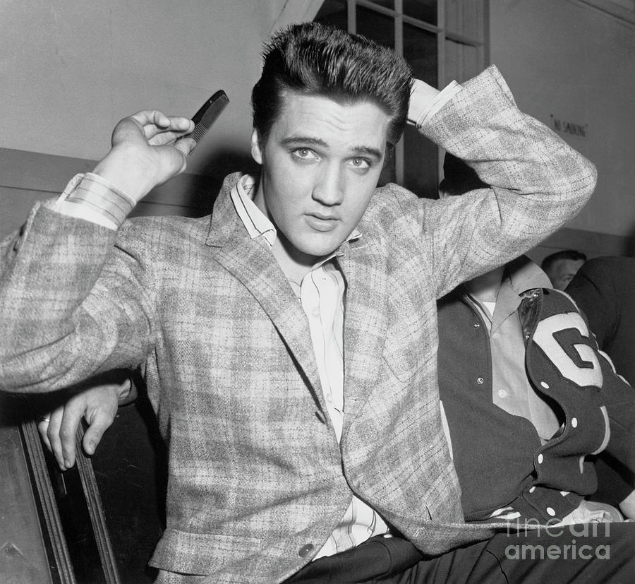 Elvis Presley Combing His Hair Photograph by Bettmann
