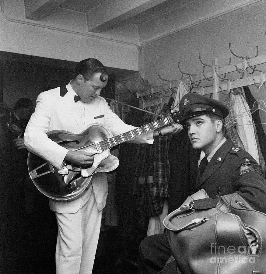Elvis Presley Listens To Bill Haley Photograph by Bettmann
