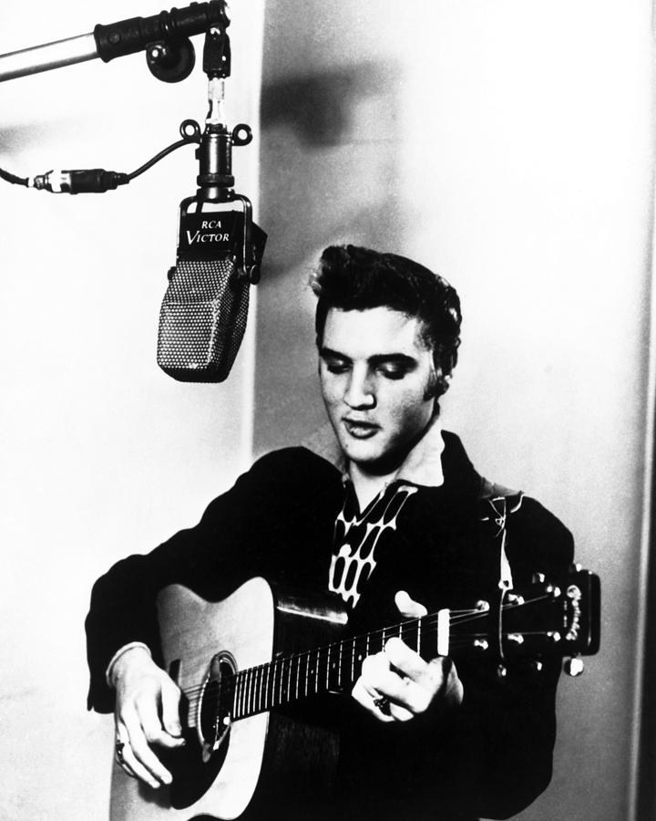 Elvis Presley Playing Guitar And Singing Photograph by Globe Photos ...