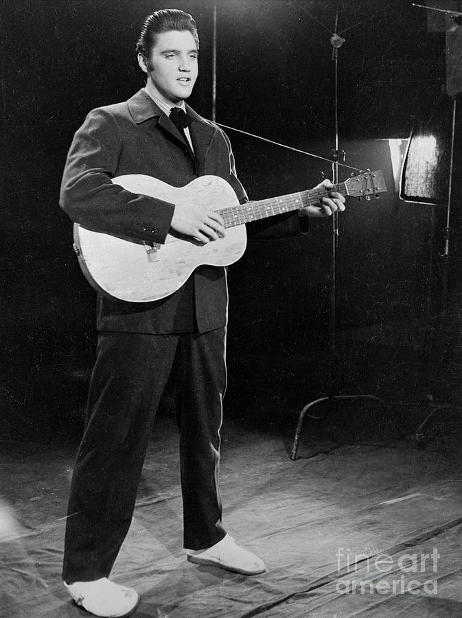 Elvis Presley Standing With Guitar Photograph by Bettmann