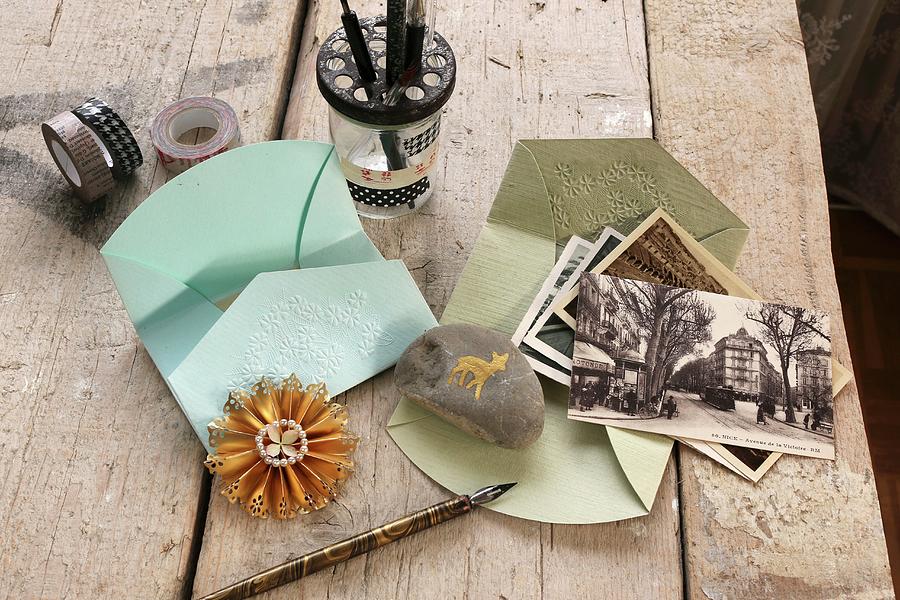 Embossed Envelopes, Pebble As Paper Weight, Dip Pens And Old Postcards Photograph by Regina Hippel