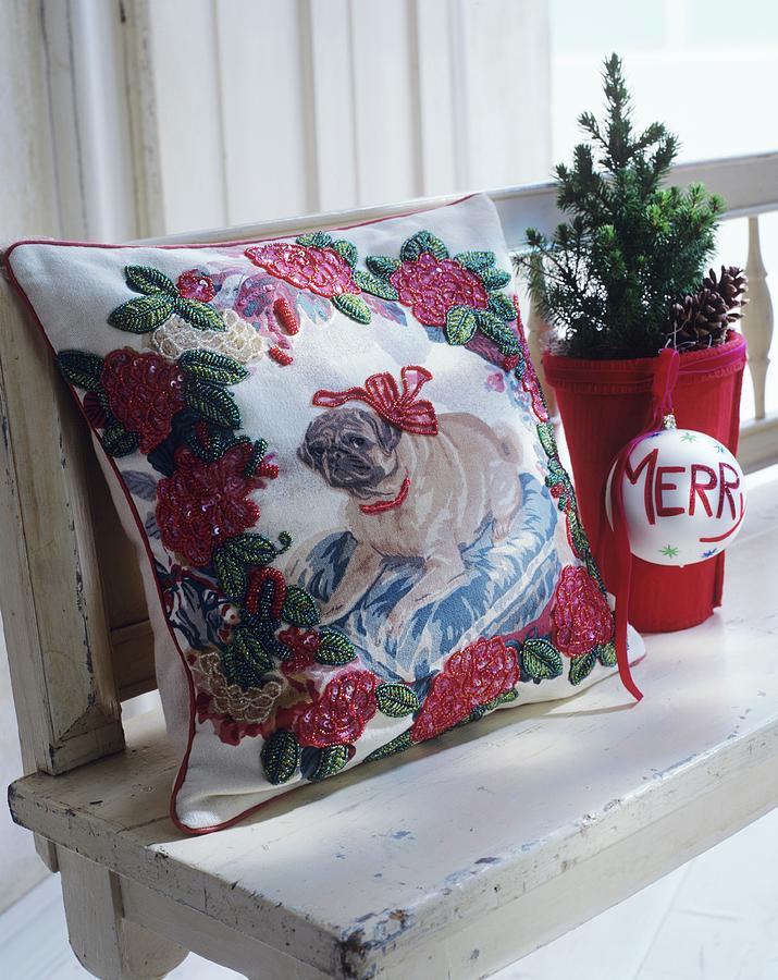 Embroidered Cushion With Dog Motif, Miniature Tree And Bauble On White, Shabby-chic Bench Photograph by Matteo Manduzio