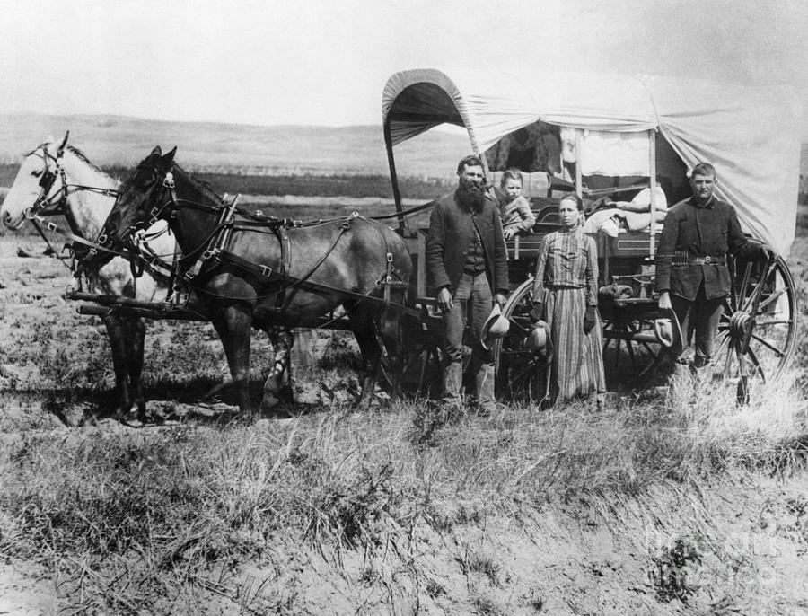 Emigrants Moving With Covered Wagon Photograph by Bettmann