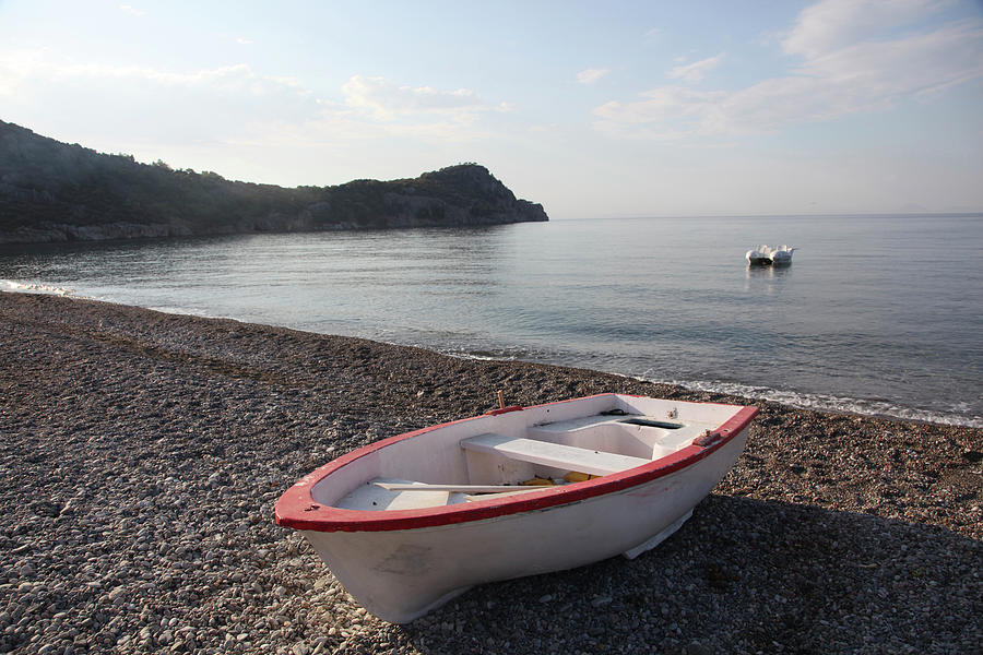 Empty Boat On Ovabuku Beach, Mesudiye, Datca, Turkey Photograph by Jalag / Dorothea Schmid