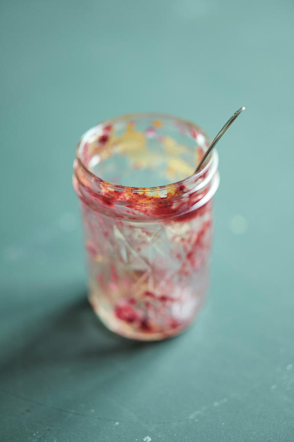 Empty Glass Jar With Cake Scraps Photograph by Oliver Brachat