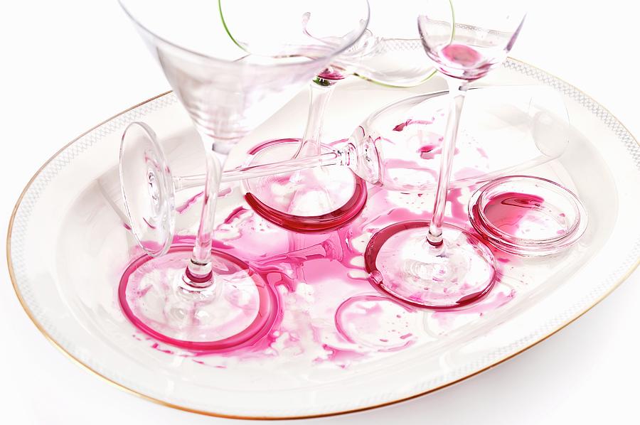 Empty Glasses On A Dirty Tray Photograph by Atelier Hmmerle