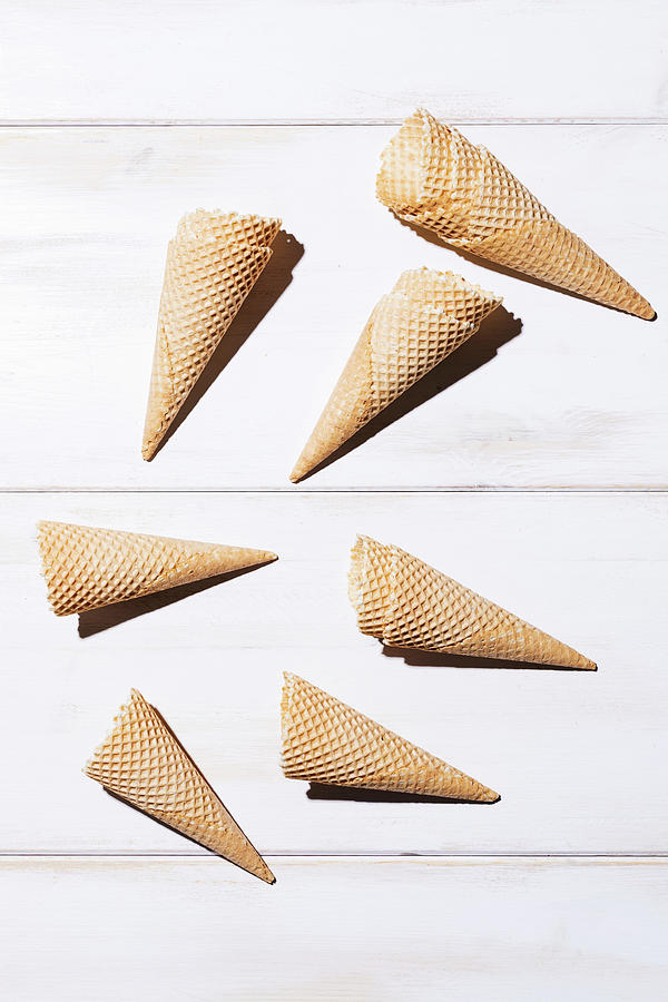 Empty Ice Cream Cones On A White Surface Photograph by Maite Paternain