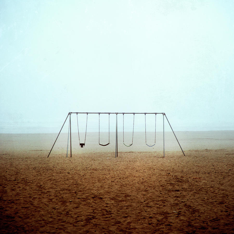Empty Swings At Beach Photograph by Marlene Ford