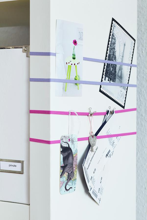 End Wall Of Shelves With Elastic Bands Used As Pin Board Photograph by Franziska Taube