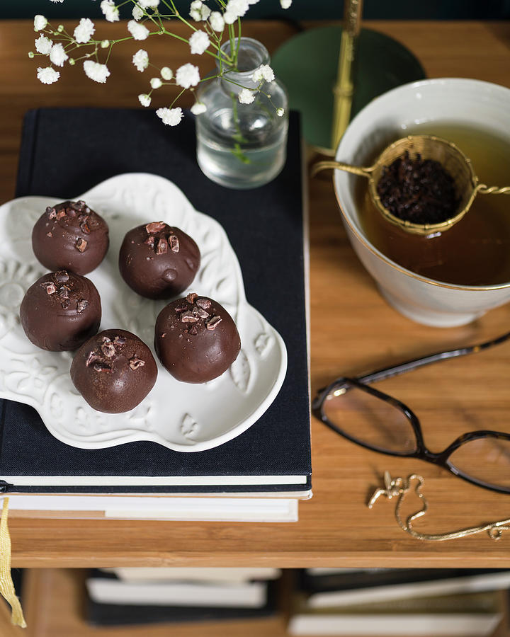 Energy Balls With Chocolate Icing Served With Tea Photograph by Cecilia Mller