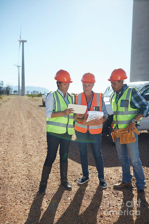 Alternative Energy Photograph - Engineer And Workers Using Digital Tablet by Caia Image/science Photo Library Alternative Energy Photograph - Engineer And Workers Using Digital Tablet by Caia Image/science Photo Library