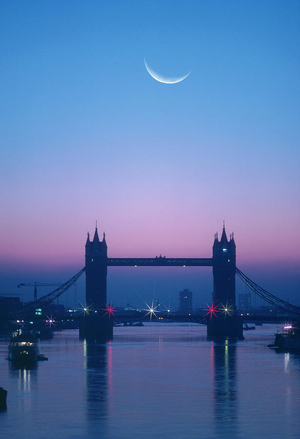 England, London, Moon Rising Over River Photograph by Grant Faint