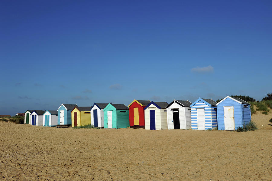 English Beach Huts Photograph by Oversnap