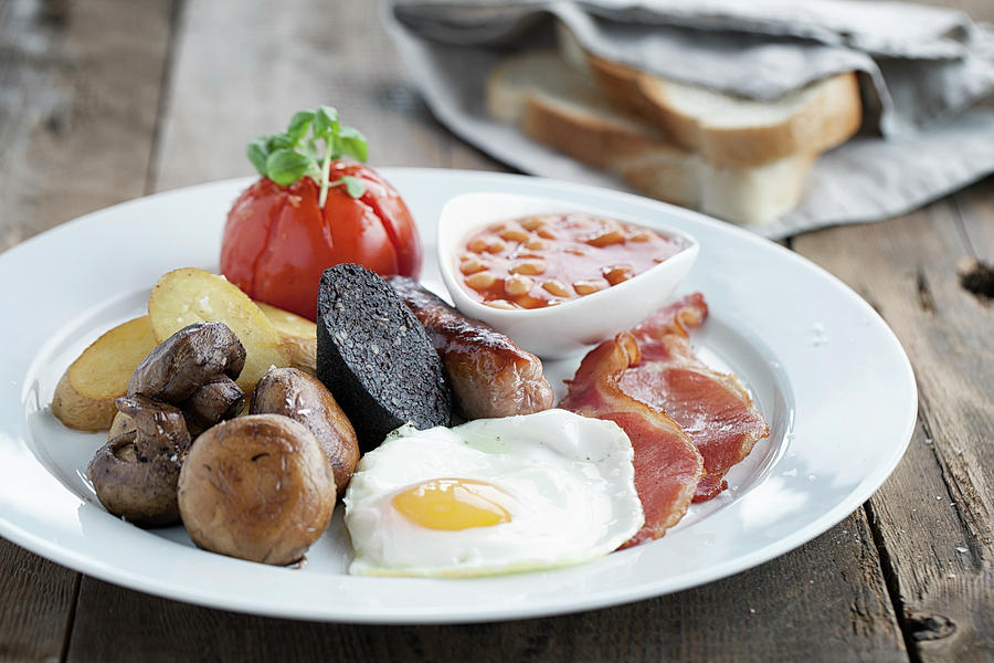 English Breakfast Served On A White Plate With White Sliced Bread In The Background Photograph by Kirstie Young