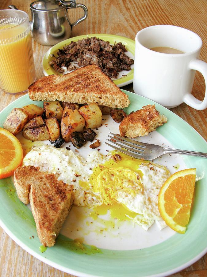 English Breakfast With Toast, Fried Egg, Fried Potatoes, Coffee And Juice Photograph by William Boch