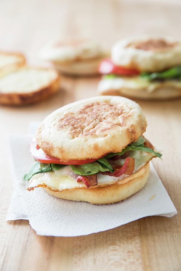 English Muffins With Bacon, Eggs And Cheese For Breakfast Photograph by Keller & Keller Photography