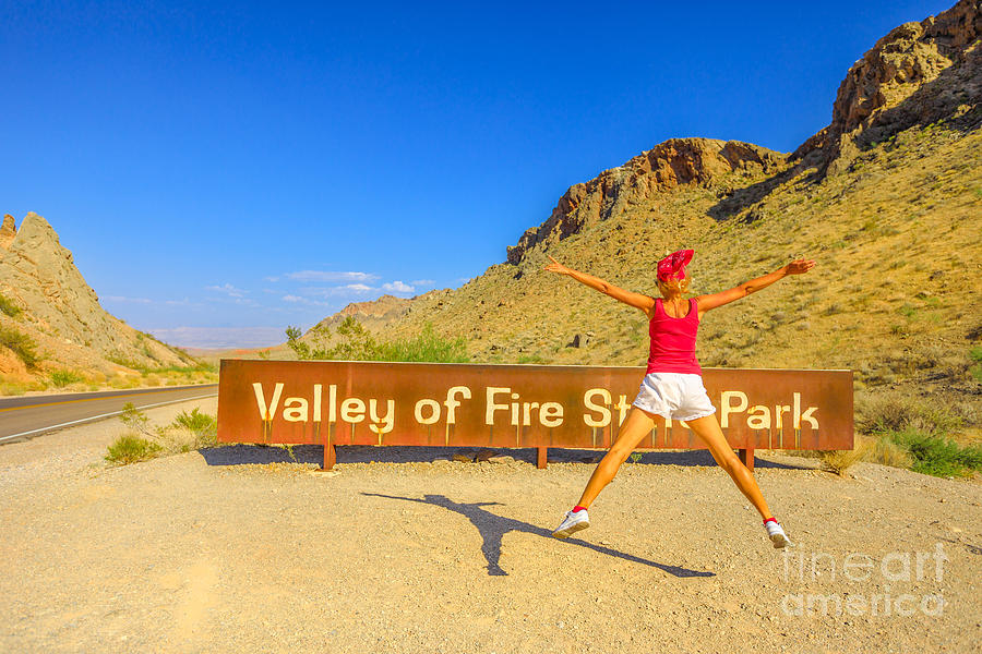 Enjoying at Valley of Fire Sign Photograph by Benny Marty