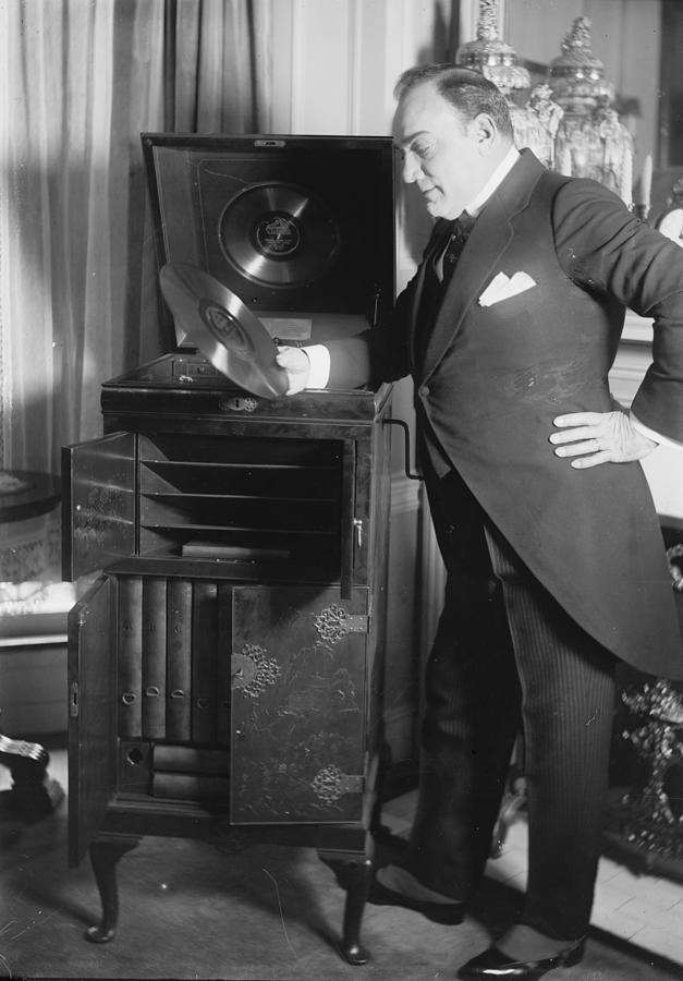 Enrico Caruso Peruses a Disk if his Singing by a Phonograph Painting by 