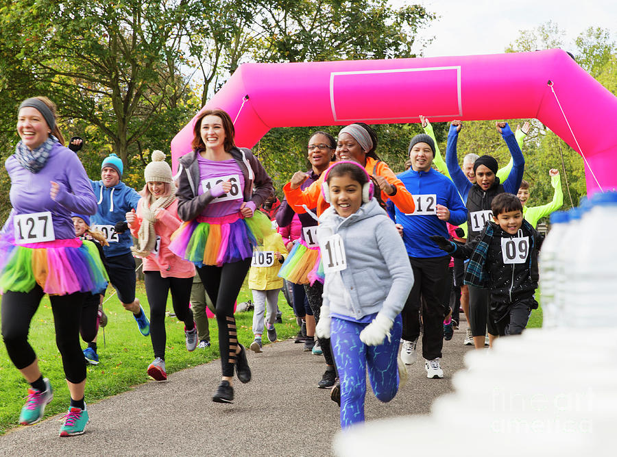 Enthusiastic Runners Running Photograph by Caia Image/science Photo Library