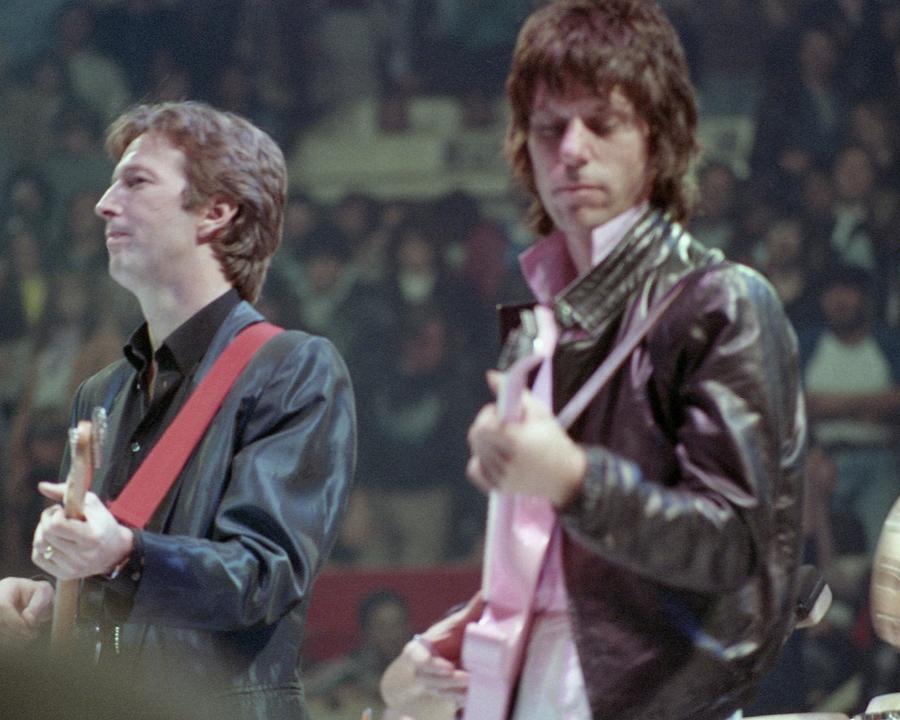 Eric Clapton Photograph - Eric Clapton And Jeff Beck Playing Guitar On Stage At Arms Charity Concerts by Globe Photos