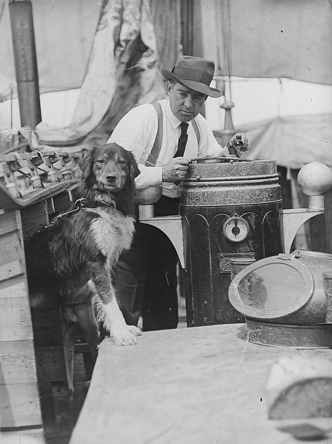 Ernest Shackleton With Dog On Board Ship Photograph by Royal Geographical Society