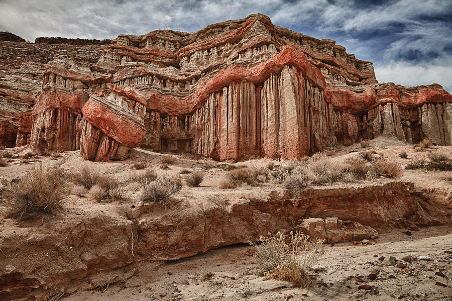 Eroded And Banded Red Rock Formation Photograph by Alice Cahill