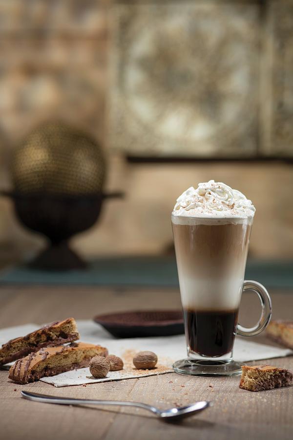Espresso Cocktail Layered In Tall Glass With Whipped Cream Nutmeg And Biscotti Photograph by Cindy Haigwood