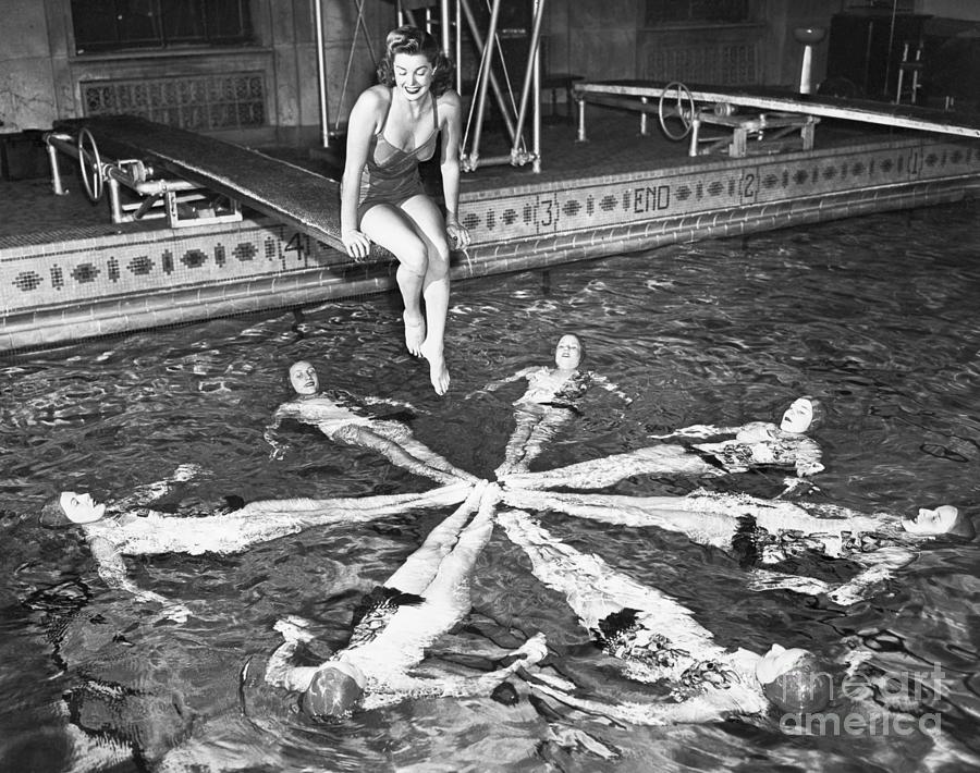Esther Williams Sitting Above Swimmers Photograph by Bettmann