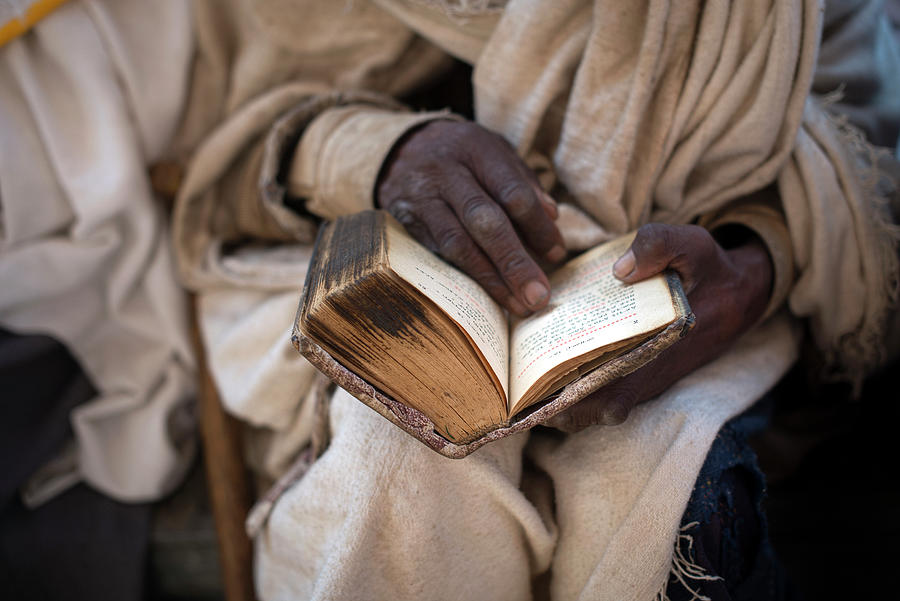 Ethiopia, Amhara, Lalibela, Priest Reading An Old Bible, Bete Maryam (house Of Mary) Digital Art by Sean Caffrey