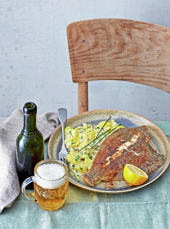 European Plaice With Potato Salad Served With Beer Photograph by Jalag / Julia Hoersch