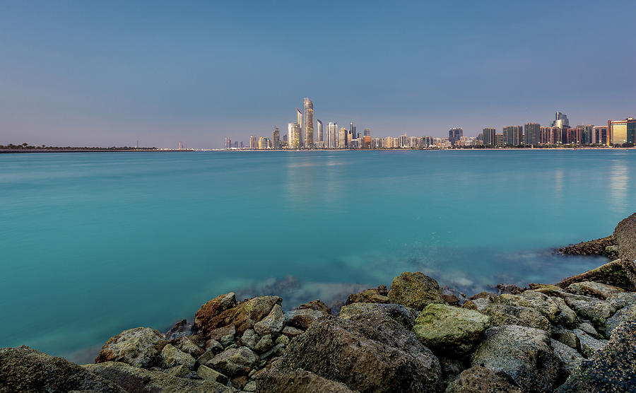 Evening View Of The Illuminated Abu Dhabi Skyline, Uae Photograph by Manuel Bischof