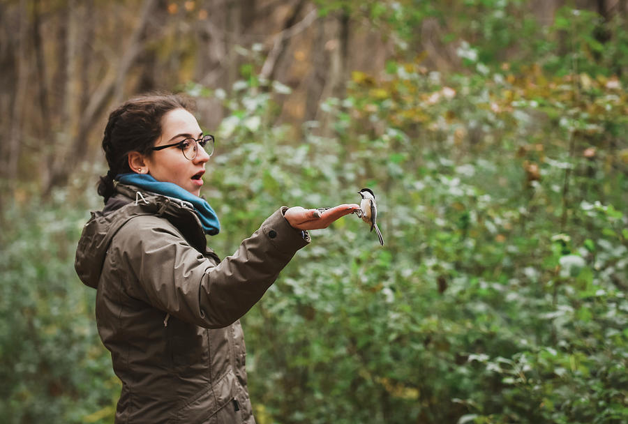 Tree Photograph - Excited Girl Feeding White Breasted Nuthatch In Forest by Cavan Images