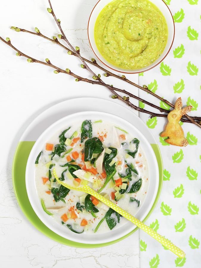 Exotic Chicken Soup With Coconut Milk And Spinach, Rabbit-shaped Biscuits And Baby Food Photograph by Gerlach, Hans